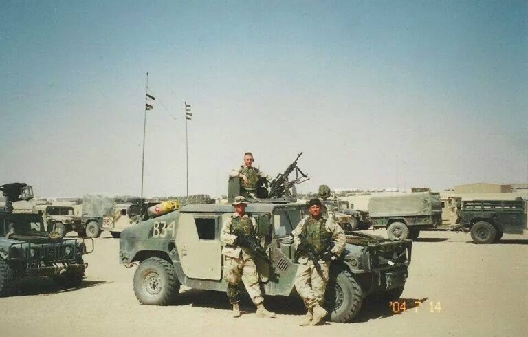 My team poses for a photo near our humvee.