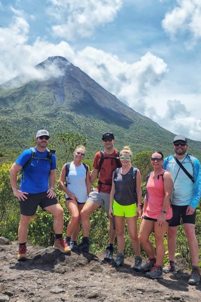 Our vacation crew hiking with Mount Arenal in the background.